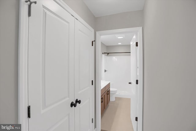 bathroom featuring vanity, toilet, and walk in shower