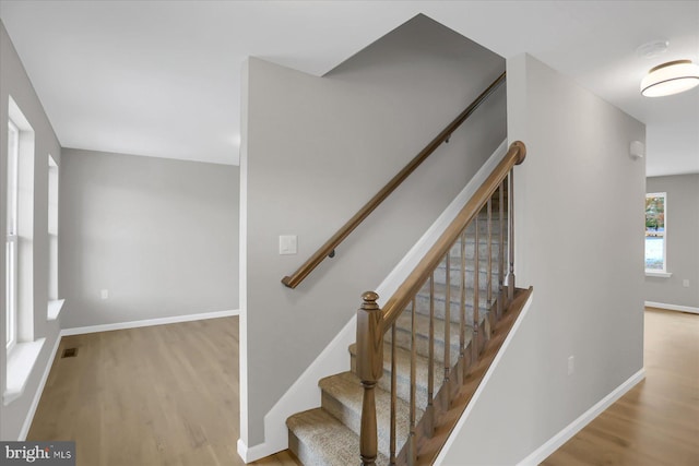 stairway featuring hardwood / wood-style flooring