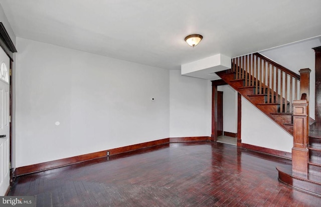 empty room with dark hardwood / wood-style floors