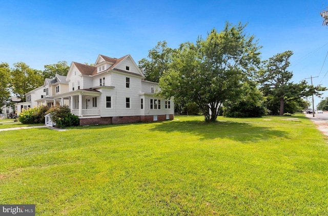 view of home's exterior with a lawn