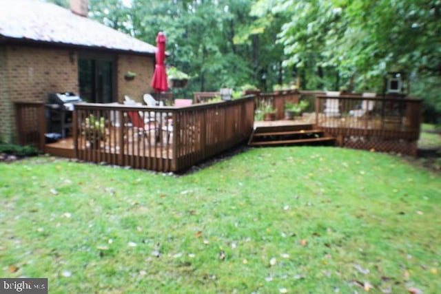 view of yard featuring a wooden deck