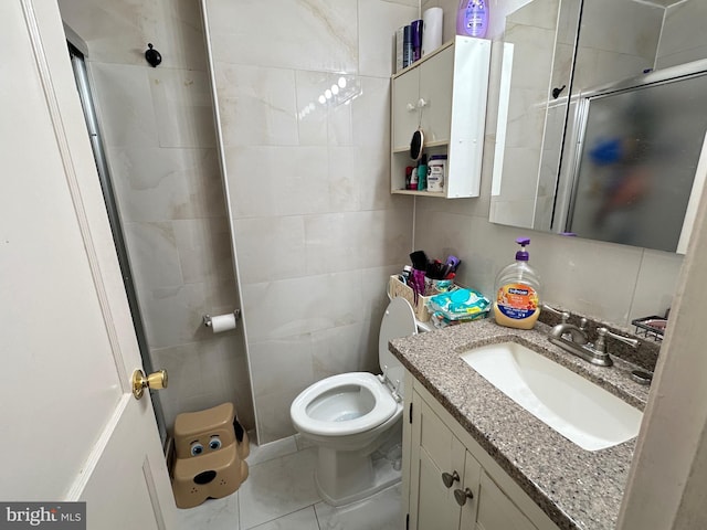 bathroom featuring vanity, toilet, an enclosed shower, tile walls, and tile patterned flooring