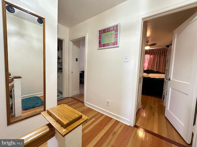 hall with light hardwood / wood-style flooring