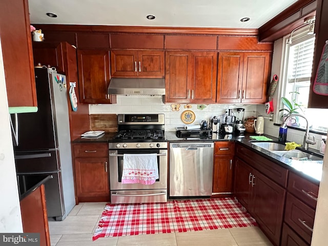 kitchen with stainless steel appliances, backsplash, and sink