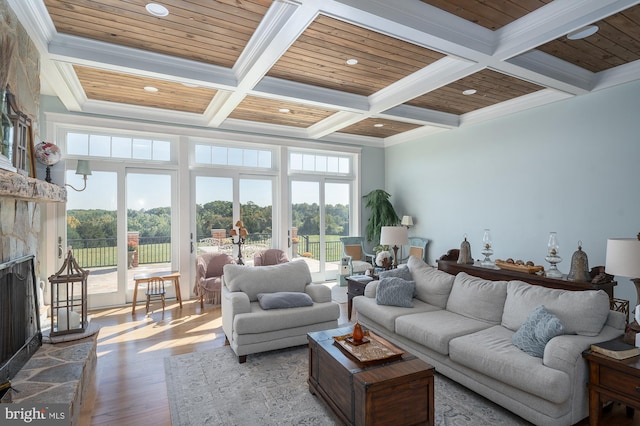 living room featuring beam ceiling, coffered ceiling, and wooden ceiling