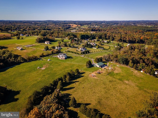 bird's eye view with a rural view and a wooded view