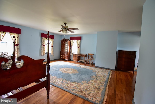 bedroom with wood-type flooring and ceiling fan