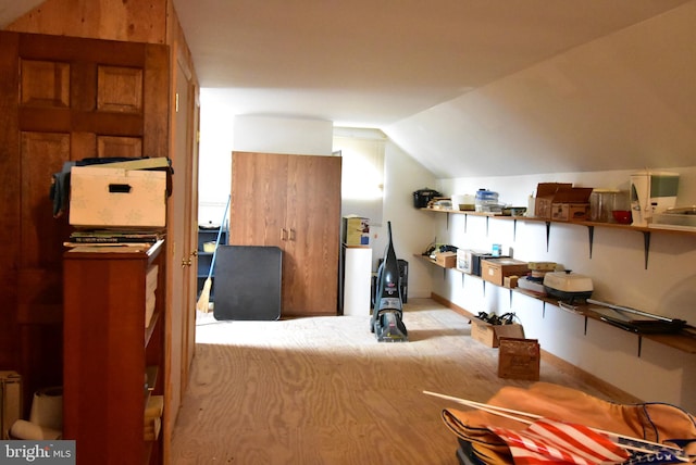 interior space featuring lofted ceiling