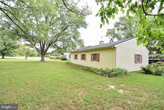 view of home's exterior featuring a yard