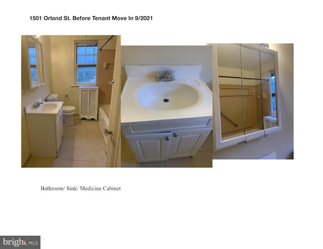 bathroom featuring vanity, tile patterned flooring, and toilet