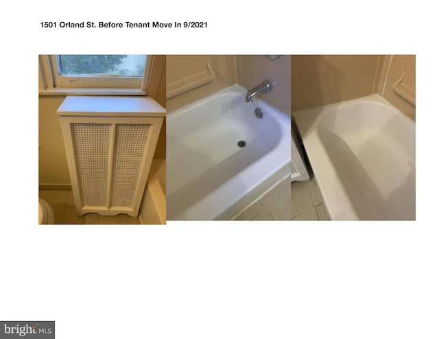 bathroom featuring tile patterned flooring and a bathing tub