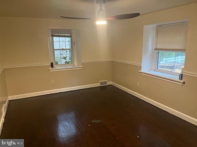 spare room featuring ceiling fan and hardwood / wood-style floors