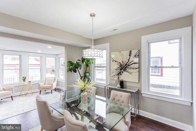 dining space featuring dark hardwood / wood-style flooring