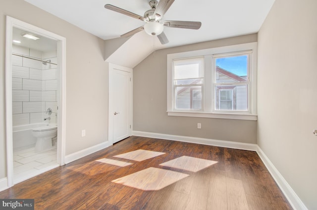 additional living space featuring ceiling fan and dark hardwood / wood-style floors