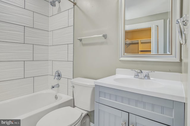 full bathroom with shower / tub combination, vanity, and toilet