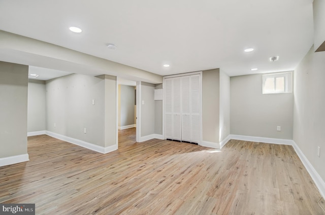 basement featuring light hardwood / wood-style floors