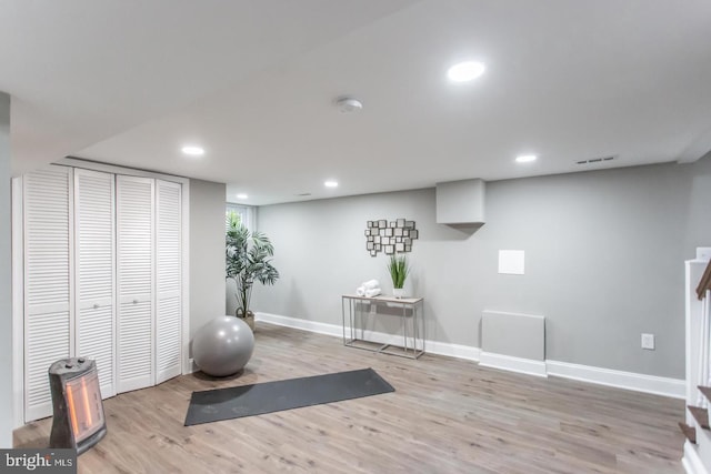 workout room with light wood-type flooring