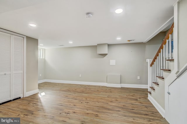 basement featuring wood-type flooring