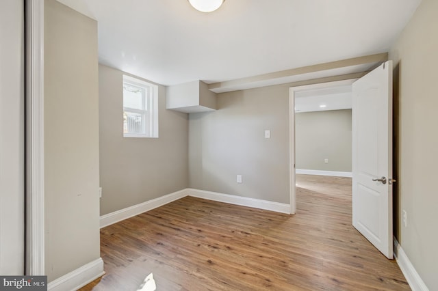 basement with light hardwood / wood-style floors