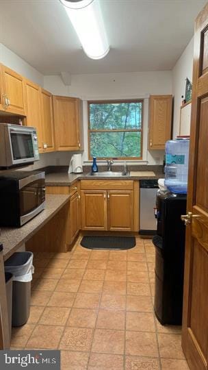 kitchen with appliances with stainless steel finishes and sink