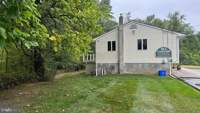 view of home's exterior featuring a yard