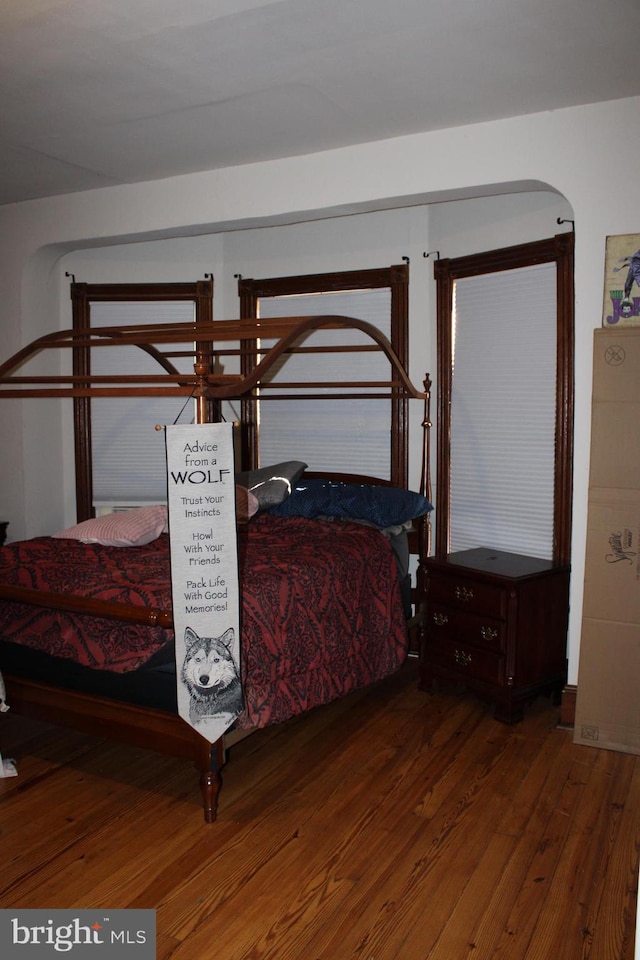 bedroom featuring dark hardwood / wood-style flooring