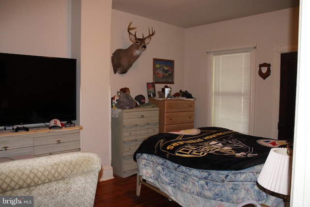 bedroom featuring dark hardwood / wood-style flooring