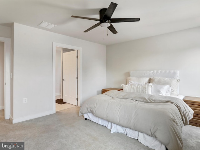 bedroom with ceiling fan and light colored carpet