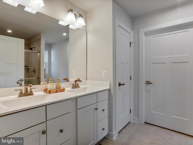 bathroom featuring vanity, tile patterned floors, and an enclosed shower