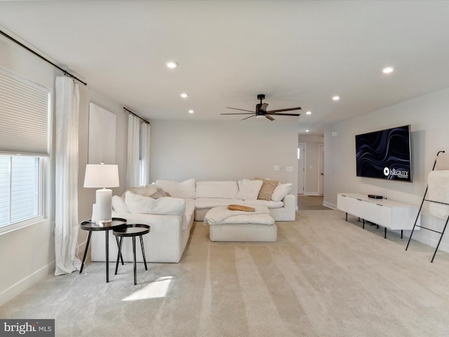 living room featuring ceiling fan and light carpet