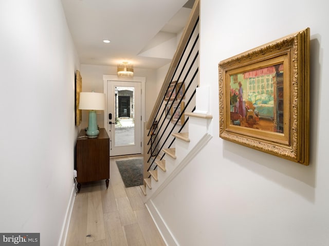 interior space with recessed lighting, stairway, baseboards, and wood finished floors