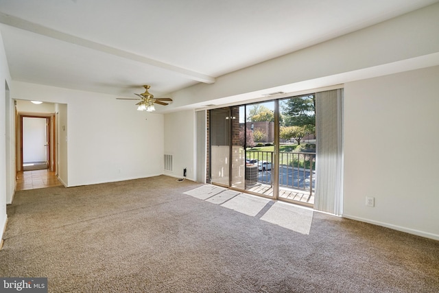 carpeted empty room featuring beamed ceiling and ceiling fan