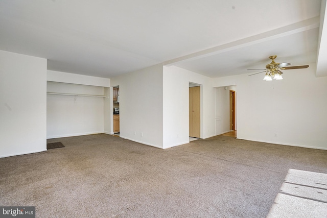 spare room with carpet floors and ceiling fan