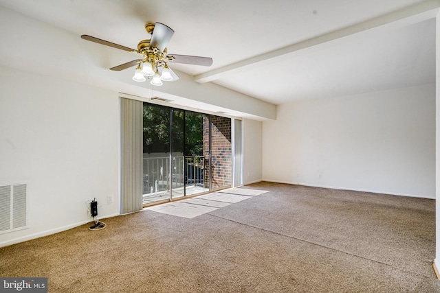 carpeted spare room featuring ceiling fan and beamed ceiling