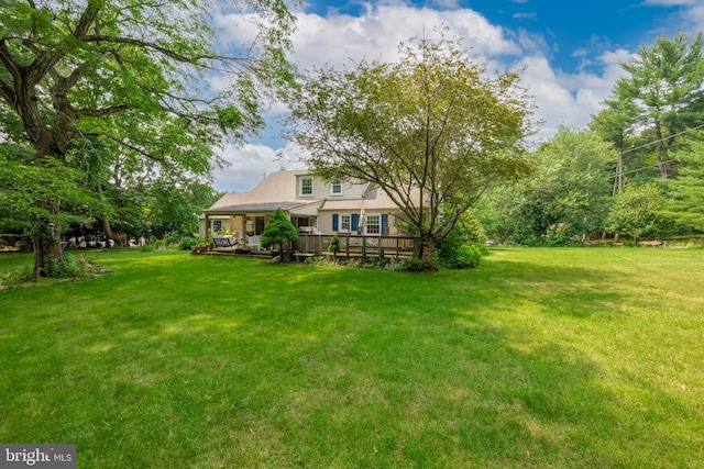 view of yard featuring a deck