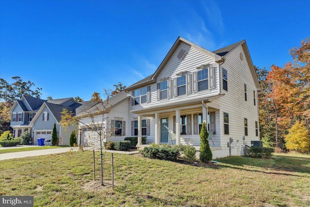 view of front of house featuring a front yard, covered porch, a garage, and central AC unit