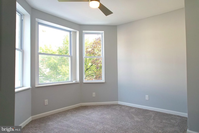 carpeted empty room with ceiling fan