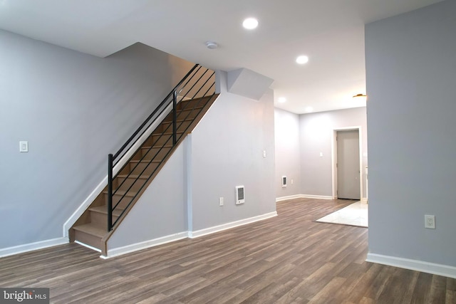 interior space featuring dark hardwood / wood-style floors and heating unit