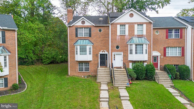 view of front of home with a front yard