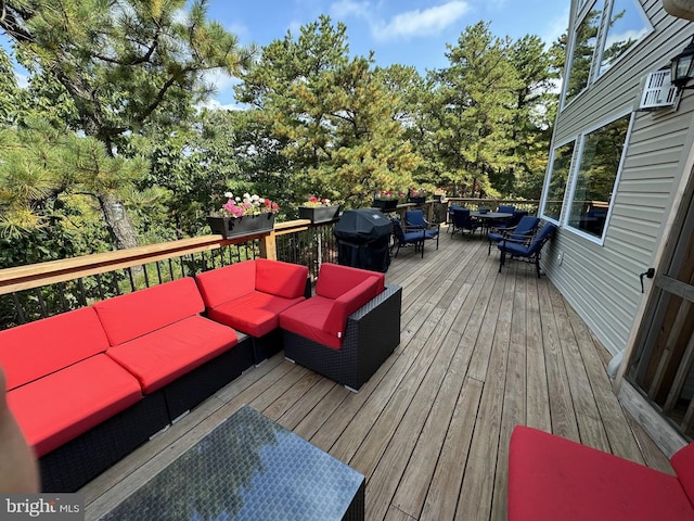 wooden deck featuring outdoor lounge area and area for grilling