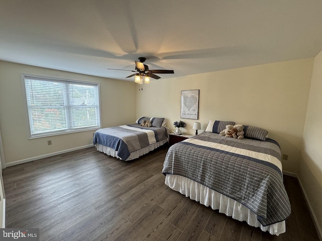 bedroom featuring ceiling fan and dark hardwood / wood-style flooring