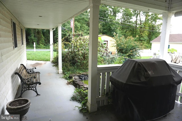 view of patio / terrace featuring a grill and a porch