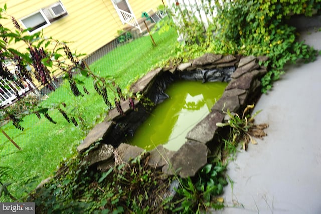 exterior details with a small pond