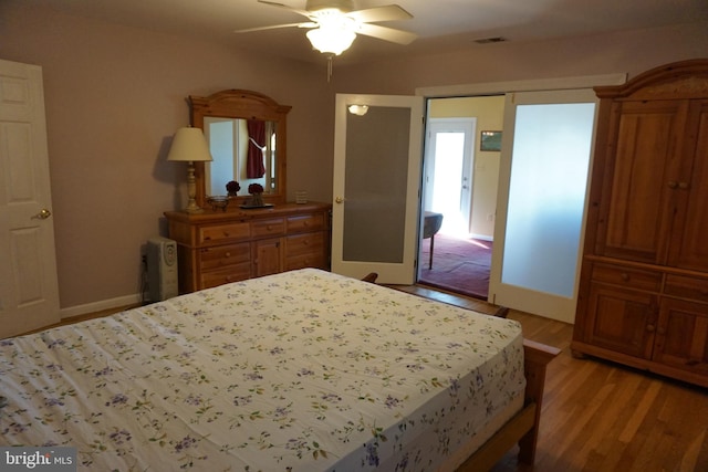 bedroom with ceiling fan and light wood-type flooring