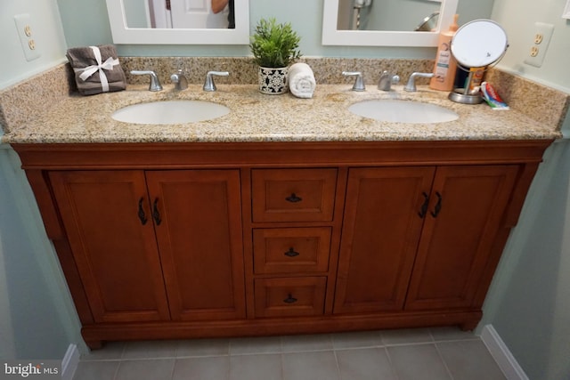 bathroom with tile patterned flooring and vanity