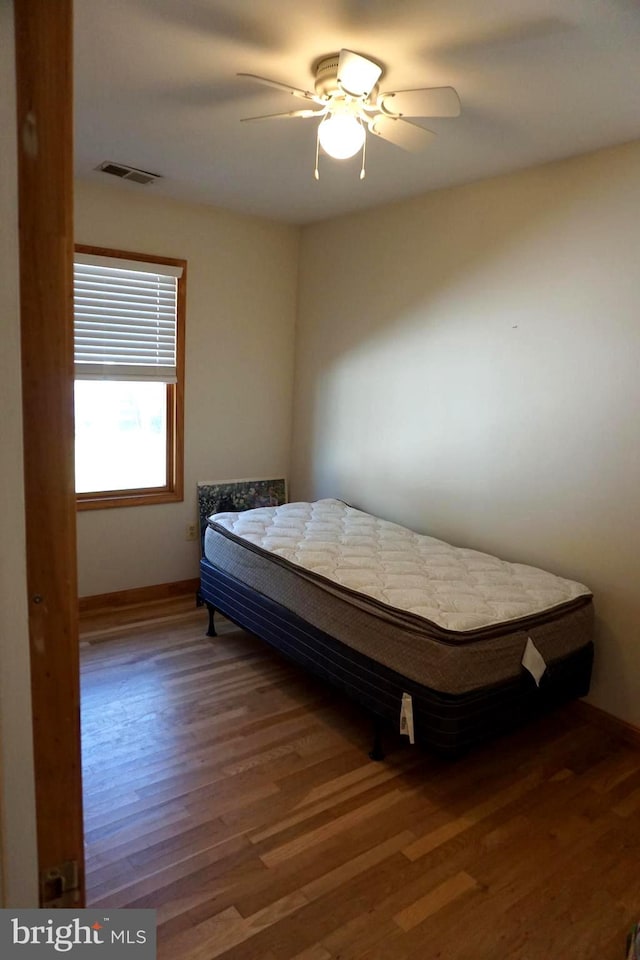 bedroom featuring ceiling fan and wood-type flooring