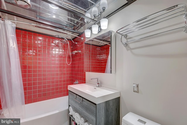 full bath with toilet, vanity, and shower / tub combo with curtain