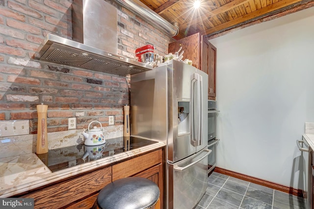 kitchen with wall chimney exhaust hood, stainless steel fridge with ice dispenser, wooden ceiling, and brick wall