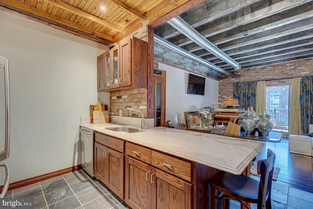 kitchen with wood ceiling, sink, stainless steel dishwasher, and beamed ceiling