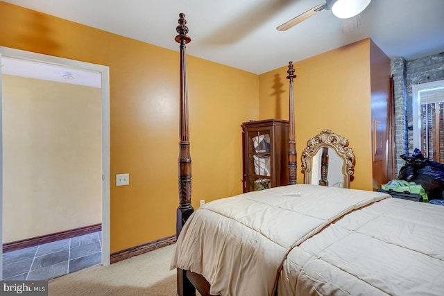 carpeted bedroom featuring ceiling fan and baseboards